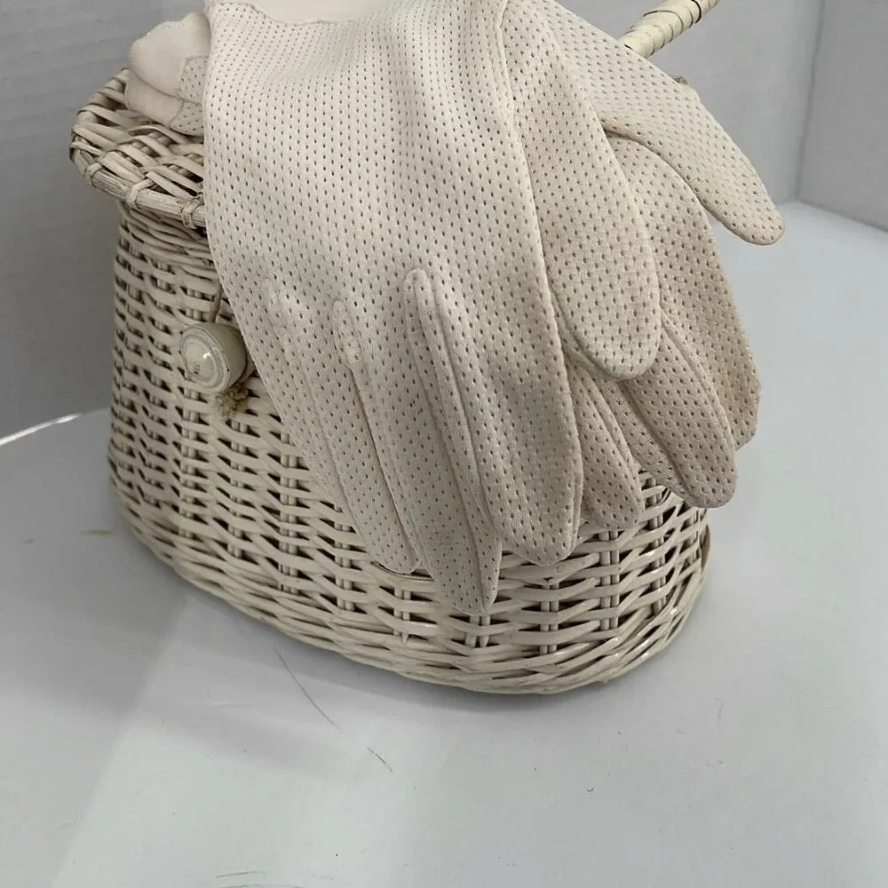 Vintage cream colored perforated gloves scalloped edges.